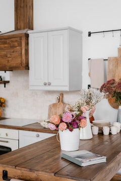 Flowers and notebook on kitchen table