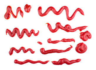 Ketchup splashes, group of objects. Arrangement of red ketchup or tomato sauce, isolated white background, top view.