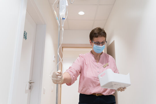 Nurse Bringing Drip To Patient Ward