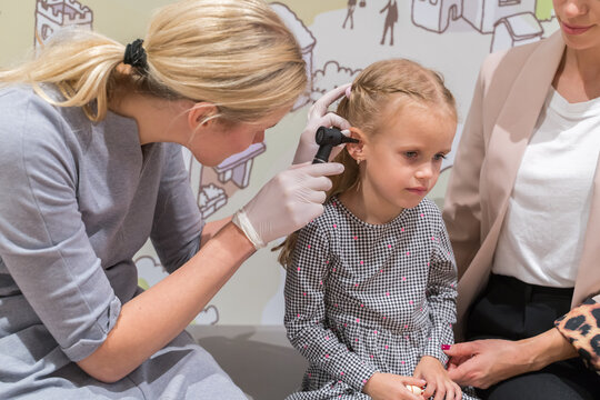 Doctor Checking Small Girl Ear