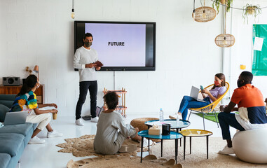 Startup team members discussing future in workspace