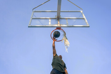 Young Man Making A Basketball Dunk.
