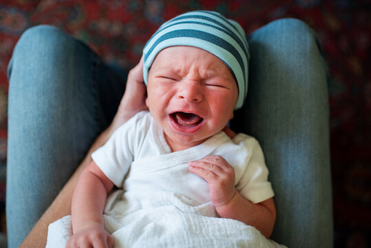 Mother Holding Crying Baby
