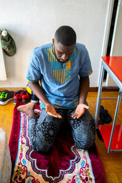 Black Muslim Praying At Home.