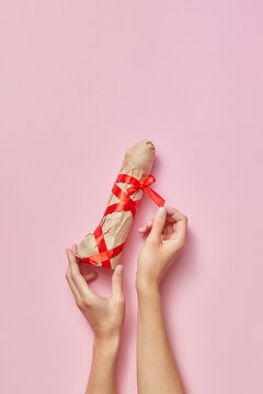 Birthday present - sex toy phallus in a woman's hands.