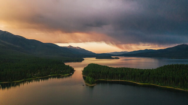 sun sets above beautiful lake