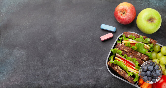 Healthy school lunch box with sandwich and fresh vegetables - Powered by Adobe