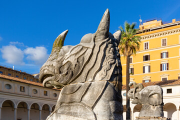 Giant ancient animal head in 16th-century garden, Cloister of Michelangelo at 3rd century Baths of Diocletian, Rome, Italy