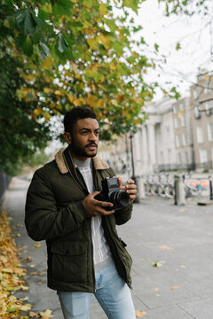 Street Photographer with a Film Camera
