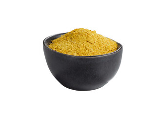 Nutritional yeast in black bowl isolated on white background.