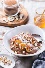 Teff grain porridge with banana topping for breakfast