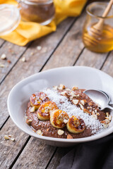 Teff grain porridge with banana topping for breakfast