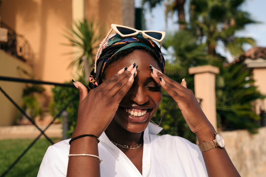 Black woman with sunglasses smiling