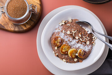 Teff grain porridge with banana topping for breakfast