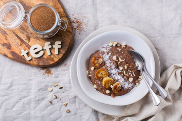 Teff grain porridge with banana topping for breakfast