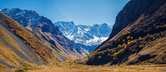 North Ossetia, Russia, Kurtatinsky gorge. View through the gorge to the snow-capped mountains