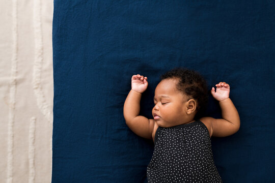 Baby Sleeping On Bed
