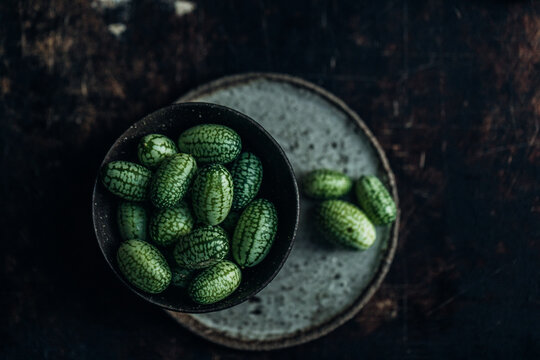 Tiny cucamelons in bowls