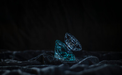 perfume bottle on dark velvet, diamond shaped perfume bottle, crystal shaped bottle with water...