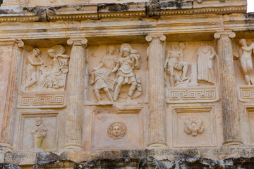Obraz premium Closeup of figured marble reliefs of antique temple Sebasteion with mythological, allegorical and imperial subjects in ancient city of Aphrodisias, Turkey