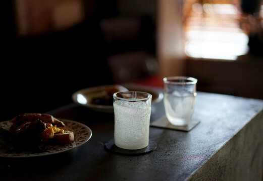Homemade beautiful coffee glasses on the table, in a dark home atmosphere