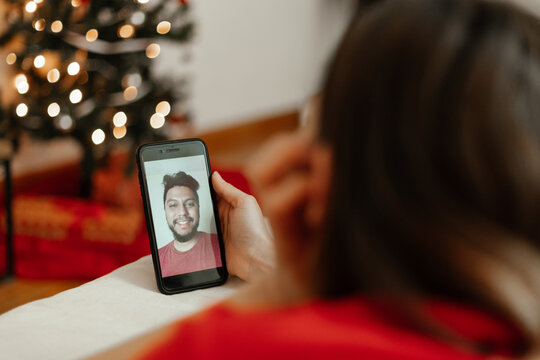 Young couple in a facetime videocall at christmas