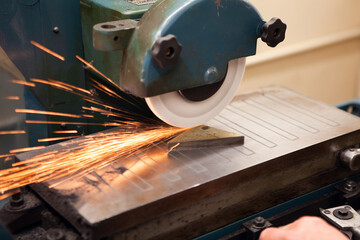 Sparks flying as a piece of metal is being cut