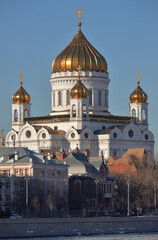 Fototapeta na wymiar View of Prechistenskaya embankment and Cathedral of Christ Saviour in early spring on sunny day, Moscow, Russia