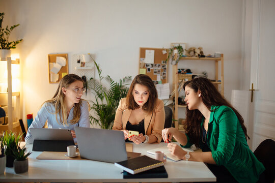 Three women working in a home office
