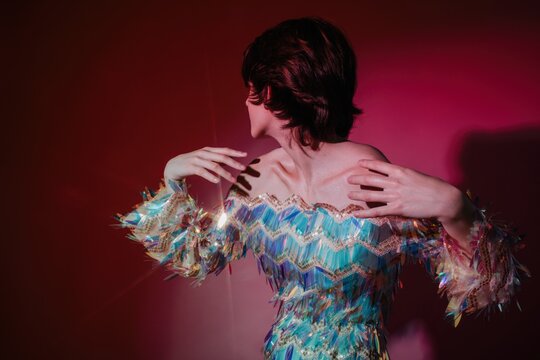 Anonymous androgynous model in shimmering dress