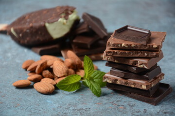 Chocolate tower. Stack of chocolate pieces. Almonds and chocolate flavor popsicle