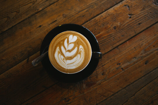 Cappuccino on the wooden table