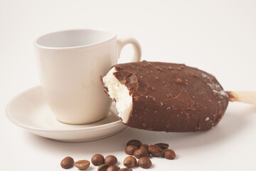 Chocolate and coffee flavor popsicle with white cup and coffee beans