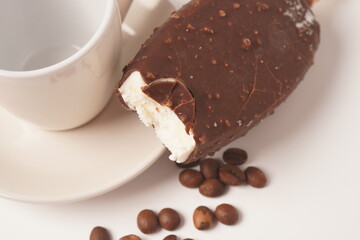 Chocolate and coffee flavor popsicle with white cup and coffee beans