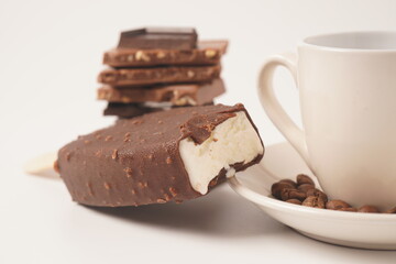 Chocolate and coffee flavor popsicle with white cup and coffee beans