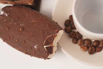 Chocolate and coffee flavor popsicle with white cup and coffee beans