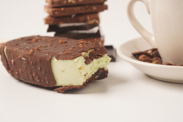 Chocolate and coffee flavor popsicle with white cup and coffee beans