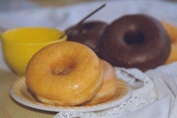 cup of coffee and delicious donuts on the table