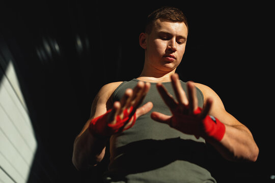 Fit boy training in sports hall