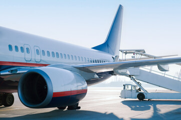 White plane in the airport terminal