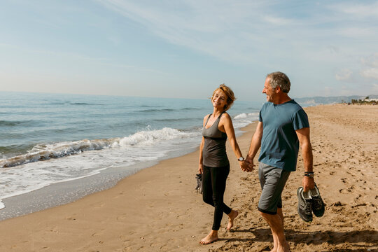 Mature couple walking on the beach