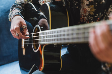Anonymous Hand Strumming an Acoustic Bass
