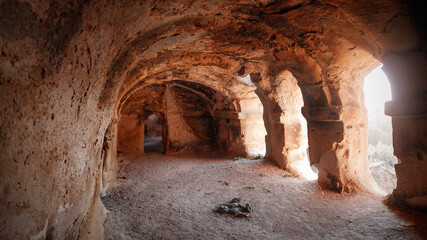 Turkey Achiksaray, suburb of Nevsehir. Ancient ruins of churches carved into sandy rocks. Cappadocia, Turkey