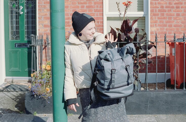 Young Studnet Says Hello to the Bus Stop