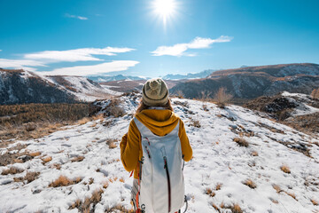 Hiker pauses for contemplation on a crisp and snowy day