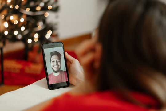 Young couple in a facetime videocall at christmas