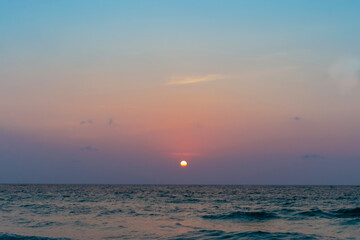 Colorful vibrant ocean sea wave beach summer with sunrise or sunset background landscape on vacation.