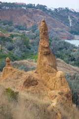 A lone limestone peak in a mountainous area