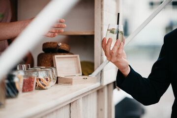 bartender serving a drink from a food truck