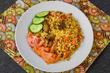 Hot traditional dish pilaf of the East. Served dish with rice on the table.